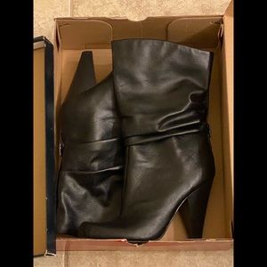 Calf high, heeled boots.Black & dark gray. Size 10